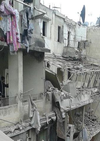 An attack on a neighborhood in Aleppo caused damage to many homes.