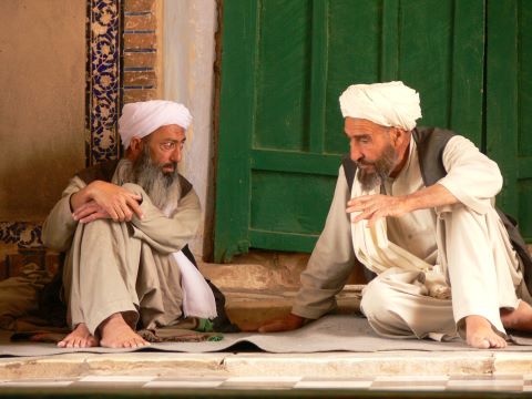 Two Afghan men chat