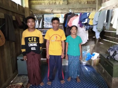 Maung Cia (middle) and his family were one of five families kicked out of their village after they participated in a worship service.