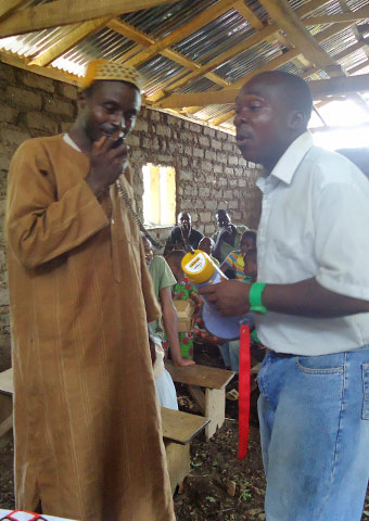A man tries out some audio equipment to share Godâ€™s message of love.