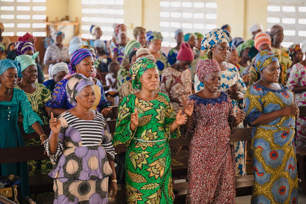 Christian women in worship and prayer in Benin.