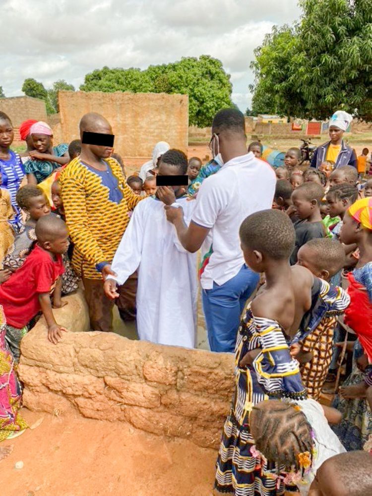 Burkinabe Christians, like these being baptized, are regularly threatened by Islamists in many areas of the country.