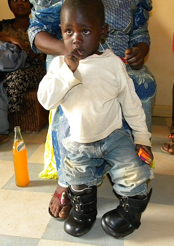 Weng stands in his new shoes.