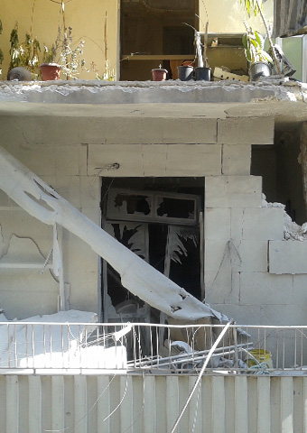 Many homes in Aleppo, Syria have been damaged or destroyed by mortar shells, including this home of a Christian woman.