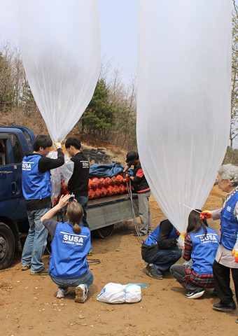 A launch team prepares to launch Bible balloons at a launch earlier this year.