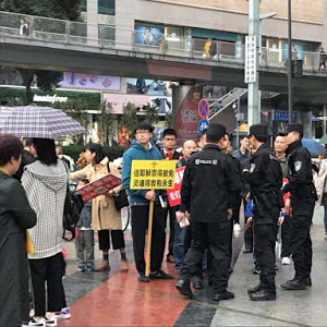 Police confronted Early Rain church member who were evangelizing on the street.