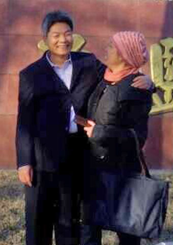Released from prison in China on Dec. 18, Wenxi Li is greeted by his wife.