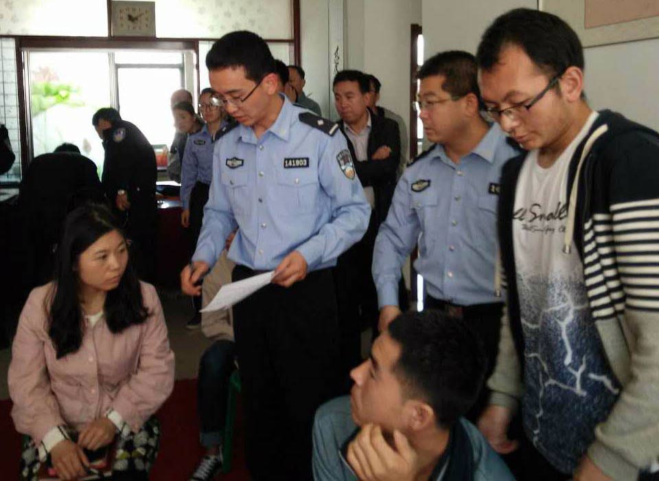 Police officials interact with members of another church at a police station.