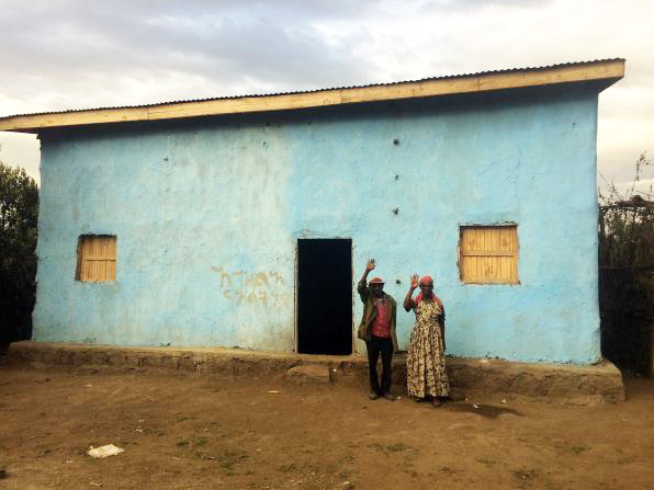 This family received a new house after theirs was destroyed in the 2017 attacks.