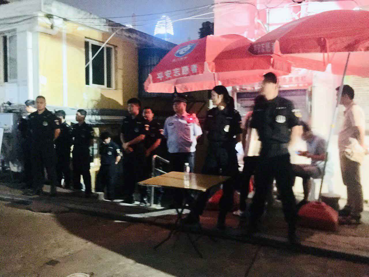 Officers form a human wall in front of Xunsiding Church.