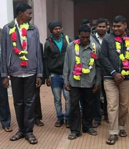 Three of the men as they are let out of prison.