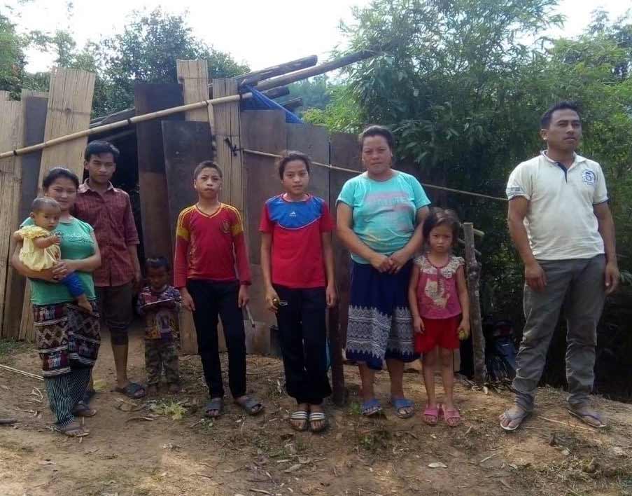 Some of the family members camping on the side of the road after they were kicked out of the village.