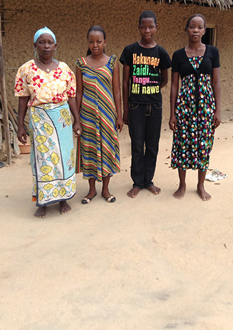 Sarah and three of her children: Rose, Emmanuel and Mary.