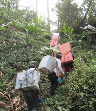 Hmong Christians delivering Bibles and other materials into remote villages in South Asia