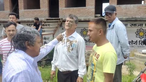 A shouting Hindu man threw mud in Elder Purna's face.