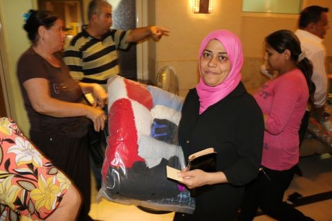 A Woman Receiving an Aid Pack in Lebanon