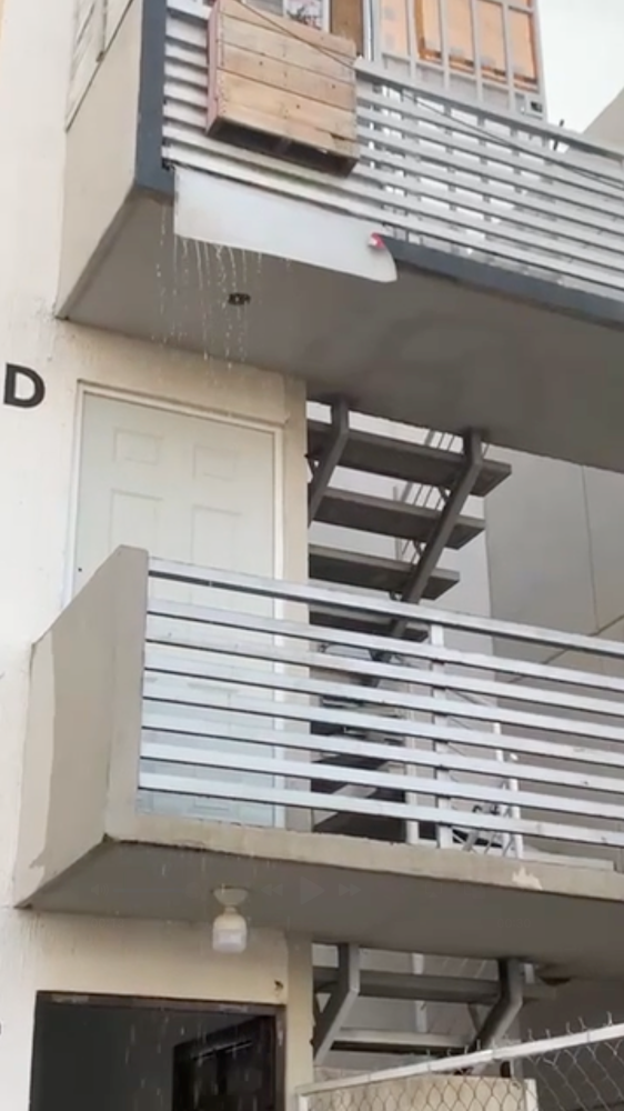 Water pours from the third-floor balcony above a house church in central Mexico.