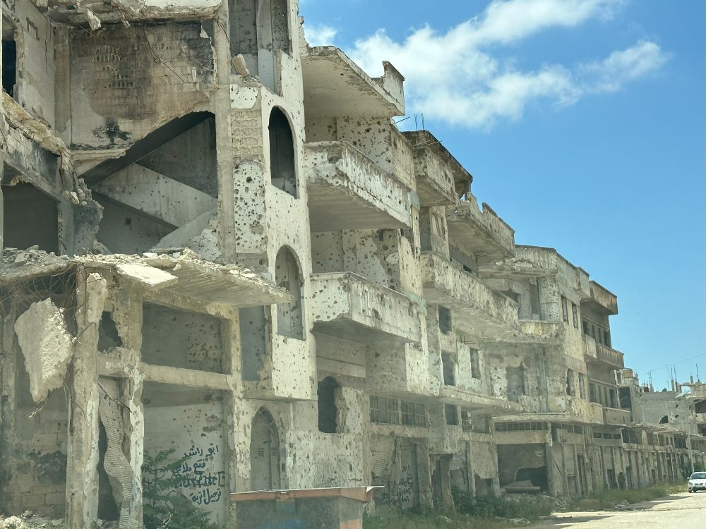 A bullet riddled building in Syria. New fighting has broken out in the city of Suwayda.