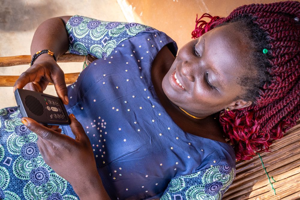 A Beninese Christian listens to an audio Bible.