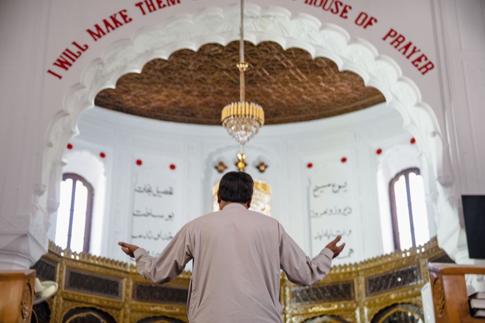 A Pakistani Christian prays inside the Peshawar church that was bombed in 2013.