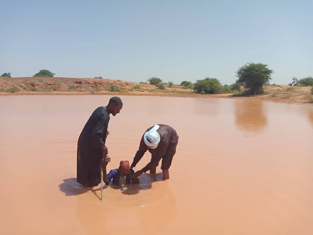 A new Christian being baptized in Niger, a country where they face increasing threats.
