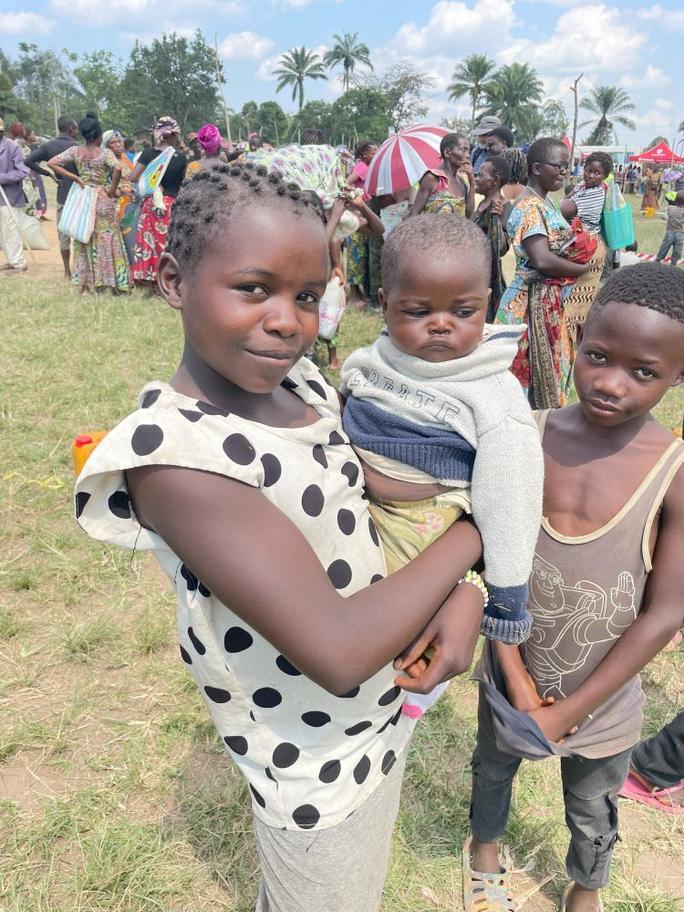These Congolese children have fled ADF rebels and are waiting for food aid provided by the global body of Christ.