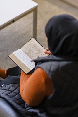 Zaynab reads her Bible and prays for her family.