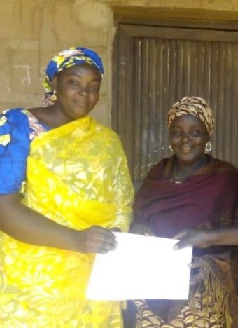 Mary Philips (on right) and her sister. Mary Philips is one of 25 widows in Nigeria who received training and financial support to help start a microbusiness to provide for their families.