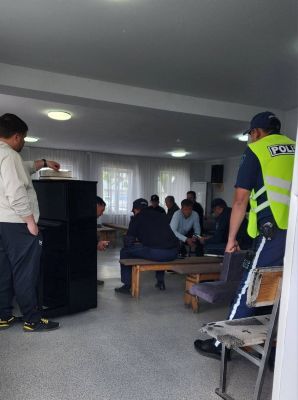 Kazakh police electronically file charges against church members inside a church in Semey, Kazakhstan.