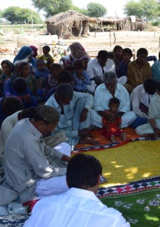 A group meets together for prayer in Pakistan