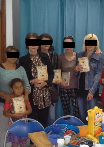 A group from Bosnia holds Christian literature recently distributed there by Christian workers.