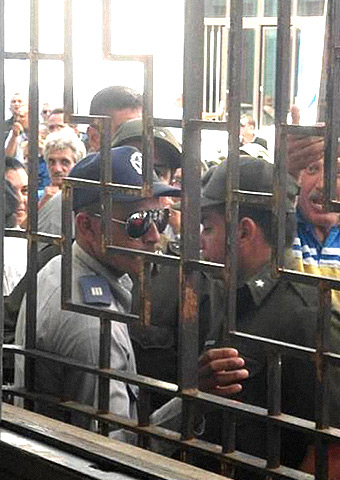 A photo taken with the cellphone of one of the house church members trapped inside the house. Police, state security and members of the neighborhood Communist Party are surrounding the house.