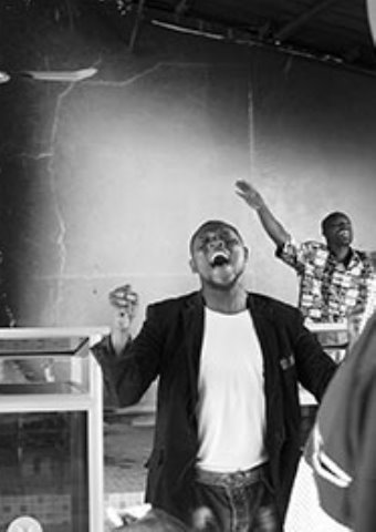 A man and others returned to their church to worship after it had been burned in January 2015.