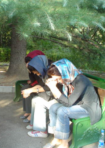 Believers from Iran pray together in park